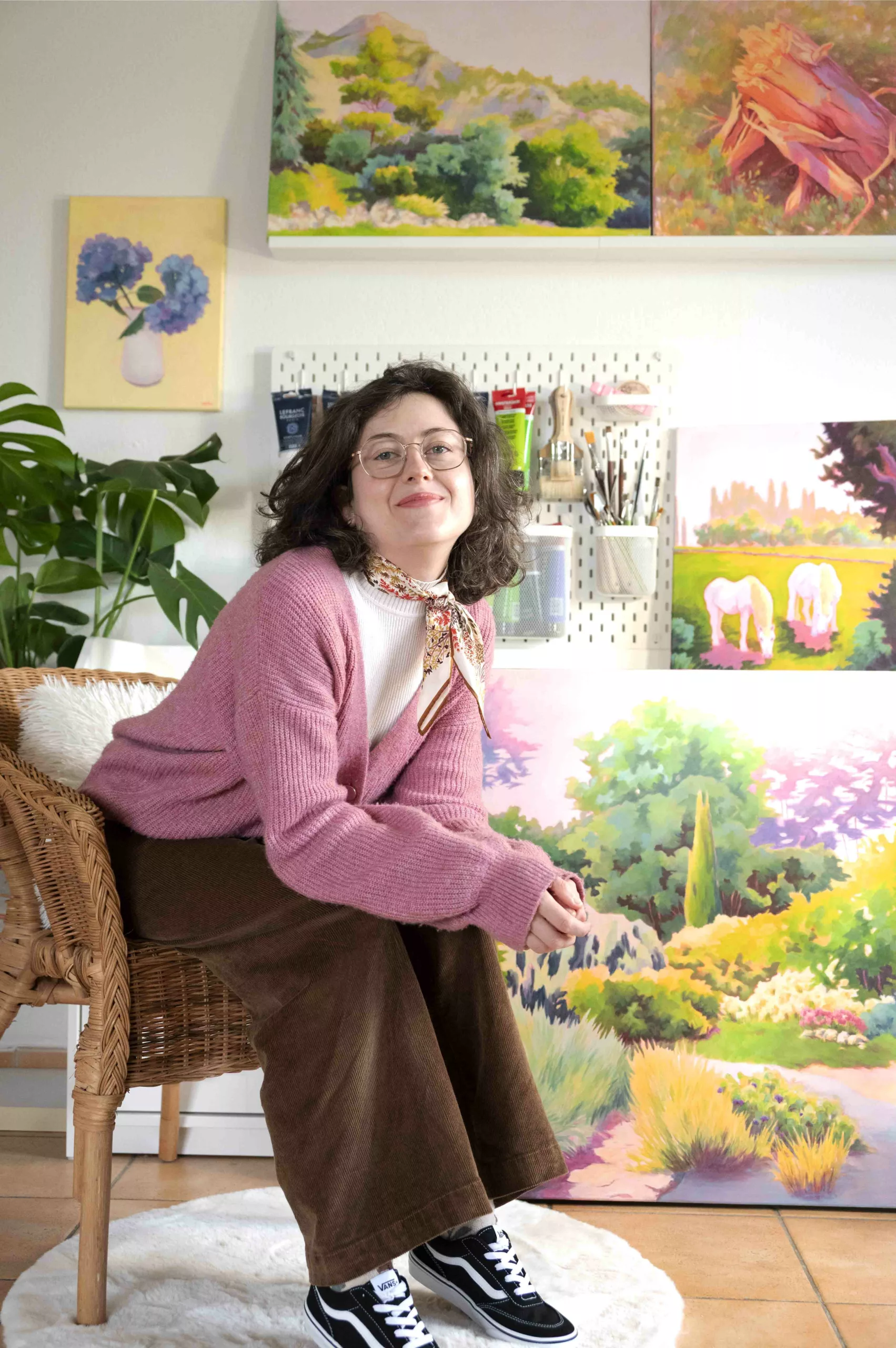 Photo of Enolie, a French artist and painter, taken in her art studio.