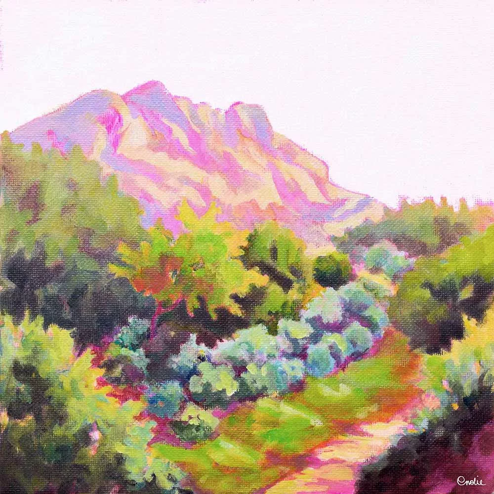 Tableau 20x20cm peint à l'acrylique sur carton entoilé par Enolie. Il représente le mont Saint-Victoire à Aix-en-Provence, dans le sud de la France. La montagne, dans des tons rosés, est entourée d'arbres aux couleurs chatoyantes. 20x20cm acrylic painting on canvas board by Enolie. It depicts Mont Saint-Victoire in Aix-en-Provence, in the south of France. The mountain, painted in shades of pink, is surrounded by trees in shimmering colors.