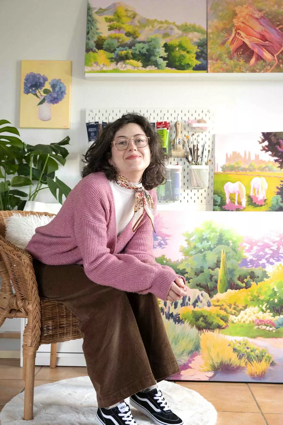 Photo of Enolie, a French artist and painter, taken in her art studio.